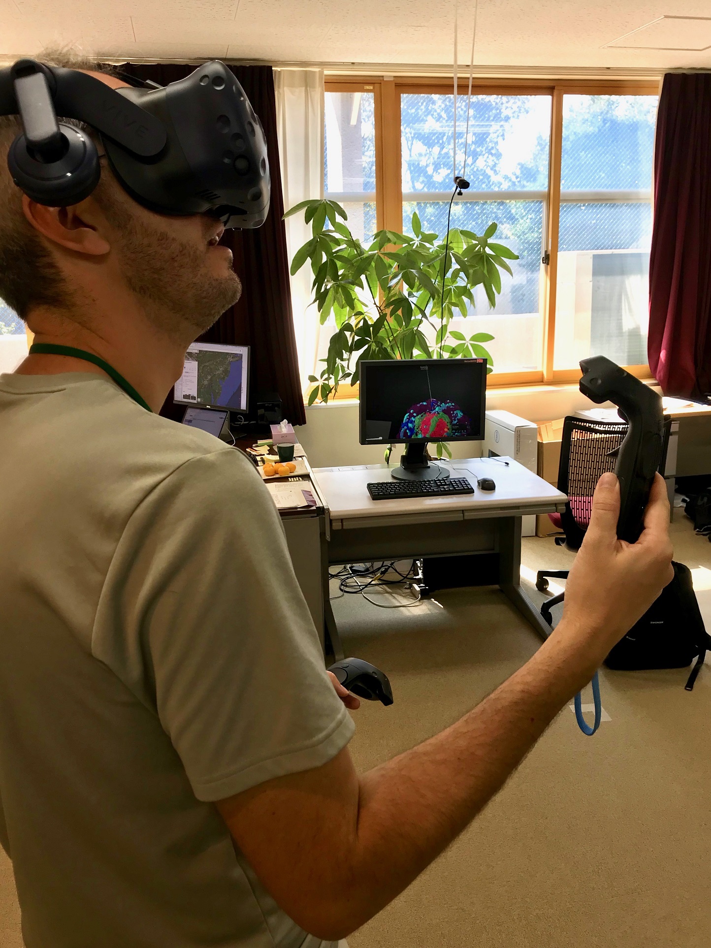 A visiting colleague, also exploring VR, tries our latest demo.